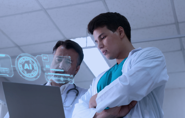 Two doctors looking at a laptop and an hologram that says 'AI'.